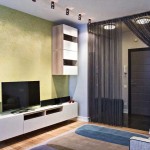 В зоне гостиной разместили современную тумбу под телевизор из IKEA
